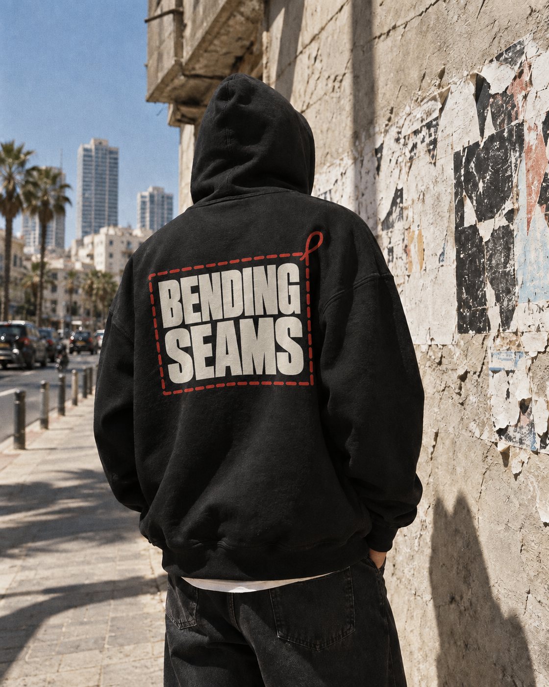 Black hoodie with the Bending Seams back print